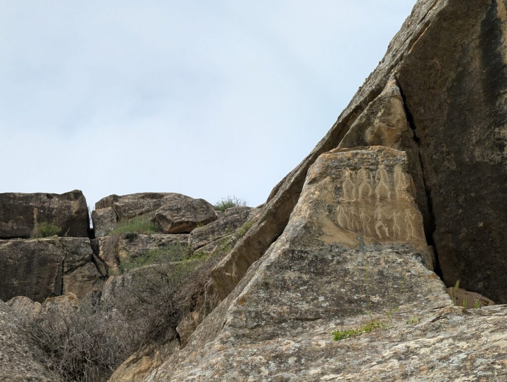 Ancient rock carvings on a boulder in Gobustan National Park