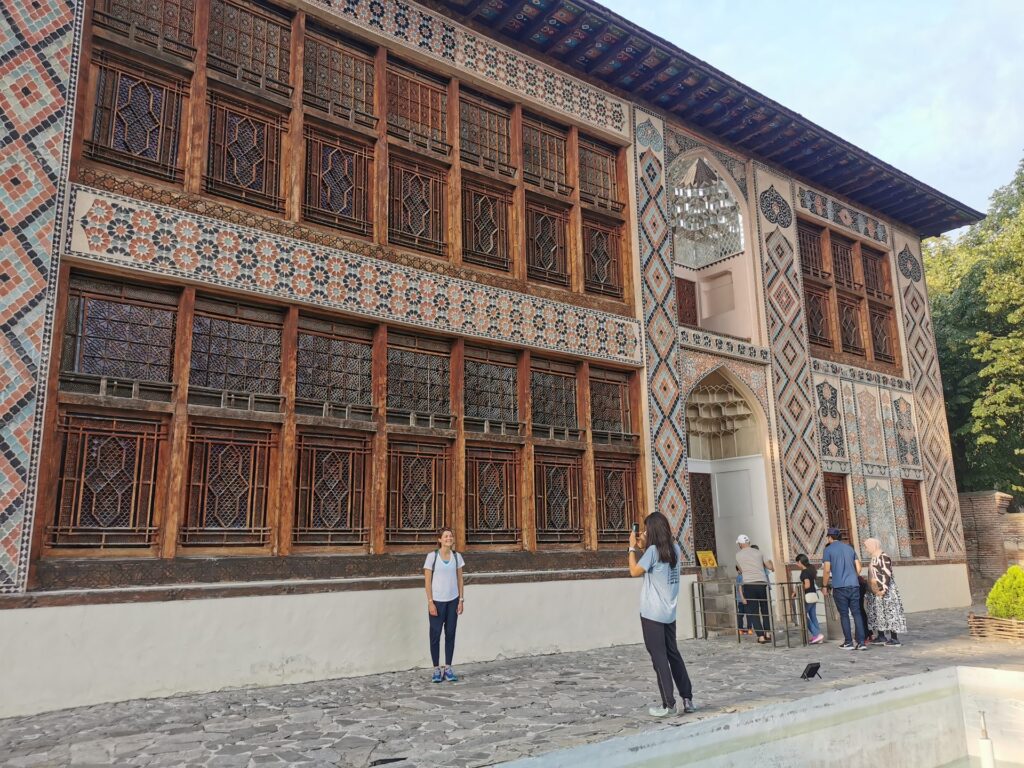 The decorated facade and stained-glass windows of the Khan's Palace in Sheki