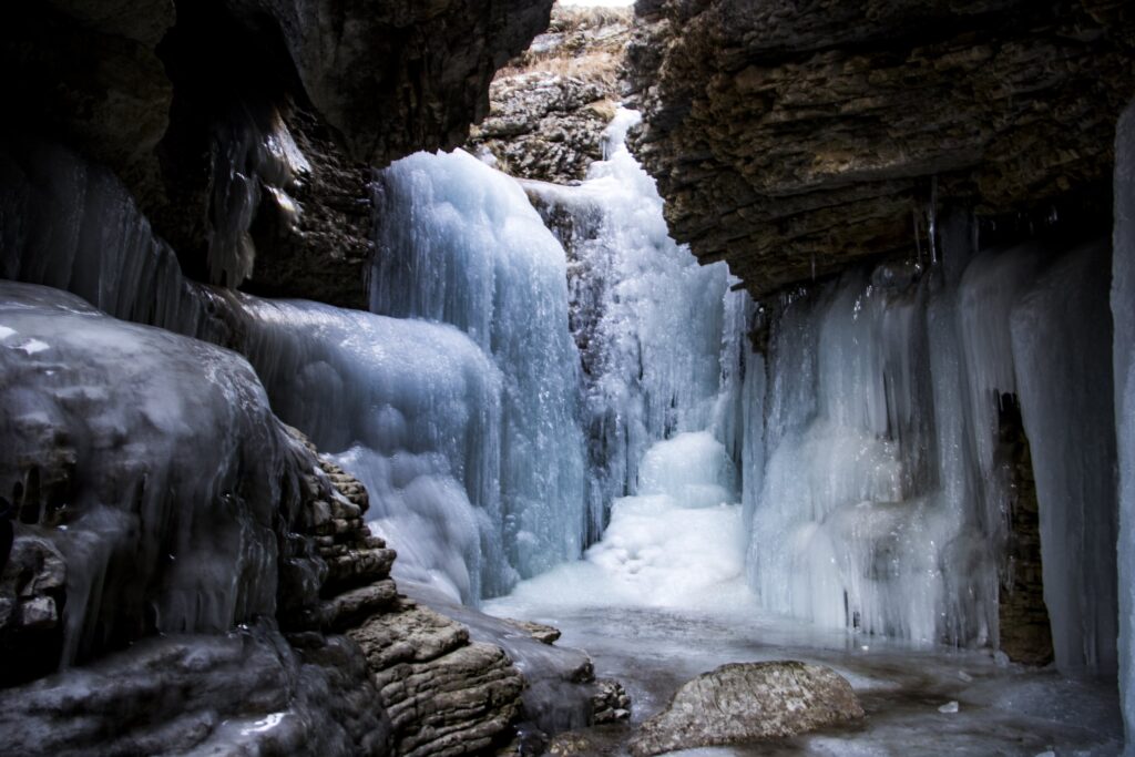 The Gur-gur waterfall near Griz frozen into walls of ice beneath a rock overhang, Azerbaijan